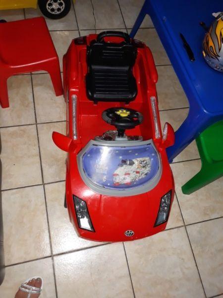 2 x Battery operated drive on cars for kids