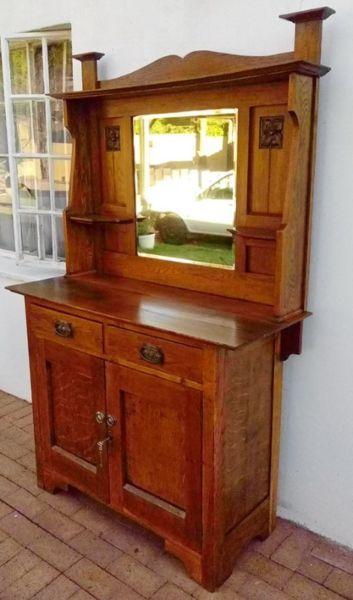 Very old Oak server cabinet with beveled mirror