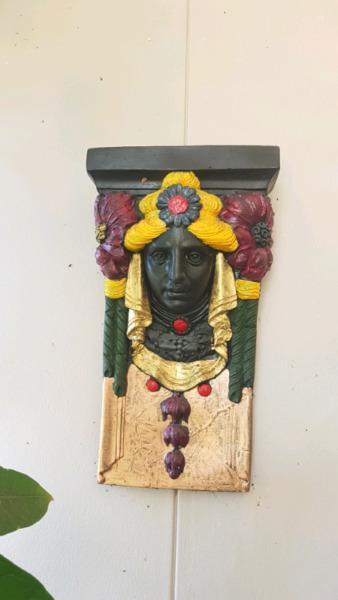Terracotta wall ornament. Painted