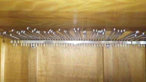 Trouser rail with hooks