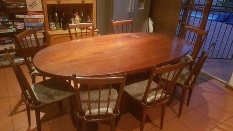 Large Imbuia dining room table with chairs