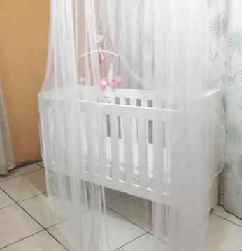 Adjustable wooden cot with accessories