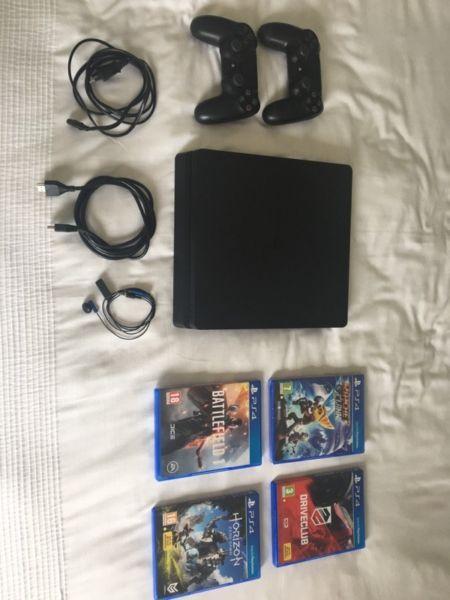 PS4 Slimline 500GB with 2 controllers and 6 games