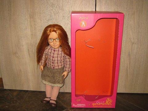 Our Generation Doll April With Glasses And Check Skirt (18Inch)