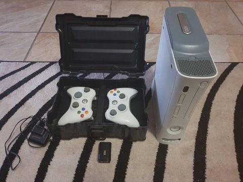 Xbox 360 with x2 remote controls/1 controller battery with charger and games