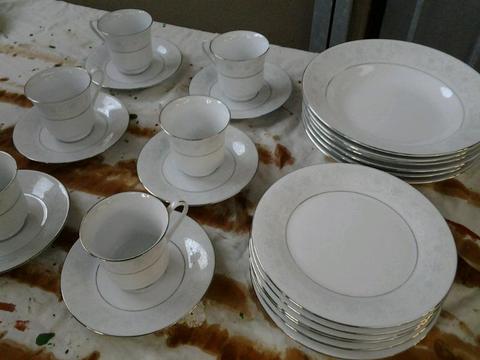 2 Sets of cups and saucers