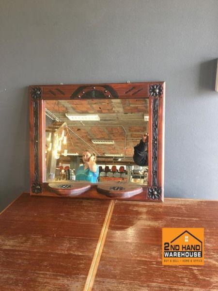 Wooden framed mirror with carvings on sides