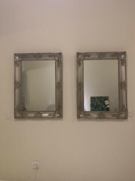 Two ornate mirrors