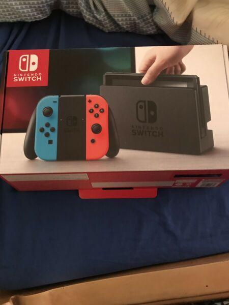 Nintendo switch console with a Mario odessy game