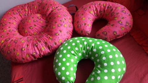 large baby donut with handle and matching baby feeding pillow