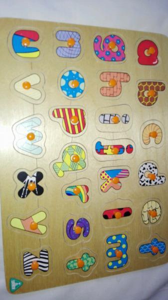 Educational wooden alphabet and shape puzzles