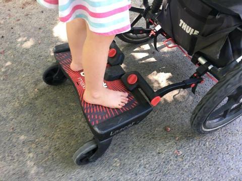 Buggy Board attaches behind pram for older kids
