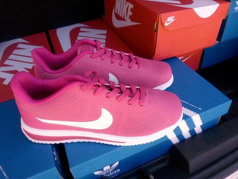 Women's pink and white runners