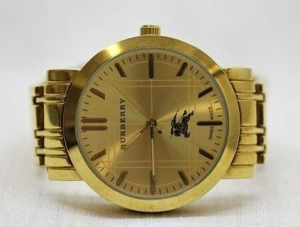 An eye-catching Burberry inspired womens wrist watch, with a gold metal case