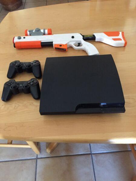 PS 3 console 2x controls and gun