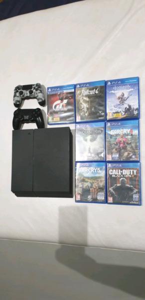 Playstation 4 with 2 controllers and 12 games