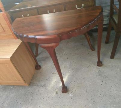 Antique ball and claw halfmoon table