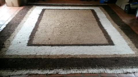 Large thickly wovem Karakul wool carpet
