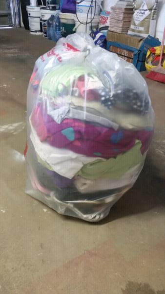 Big plastic bag with girl's clothing for sale.In good condition