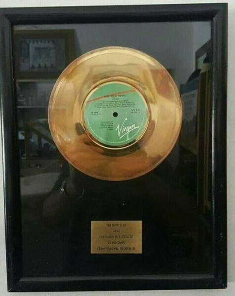 Golden 7's record award Presented to UB40 for the album Red Red Wine 