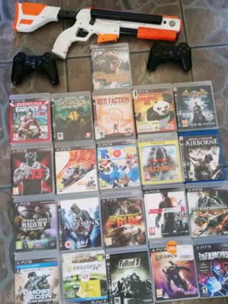 PlayStation 3 with games and controllers 