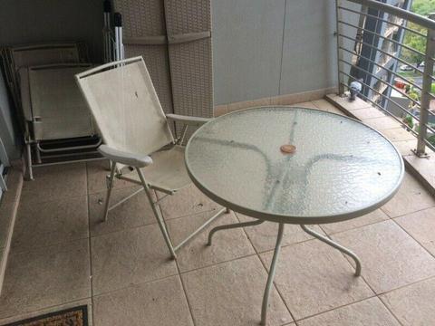 Patio table and 4 chairs for sale 