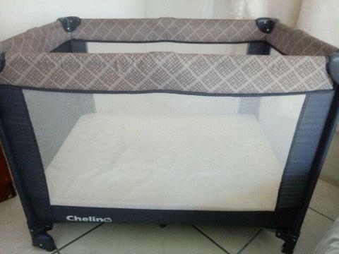 Good-condition Chelino camp cot with mattress pillow and sheet 
