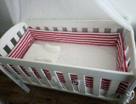 White wooden baby cot 