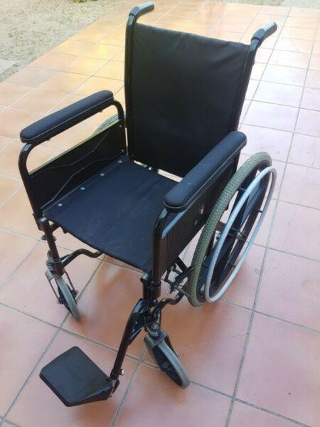 Soild wheel Chair with rubber wheels. Great condition. Only has one leg piece. 