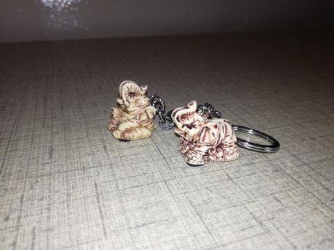 new imitation ivory elephant keyring souvenirs. organza bags also available 