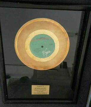 Golden 7' s record award Presented to The Twinkle Brothers 