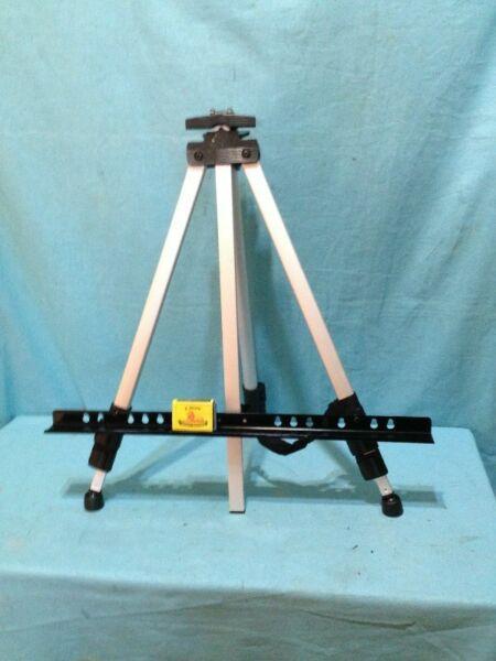 R140.00 … Light Wt Ht. Adjustable Aluminium Easel. Table Top To Tall Free Standing. Max Ht: 120cm. 