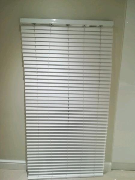 white wooden blinds  