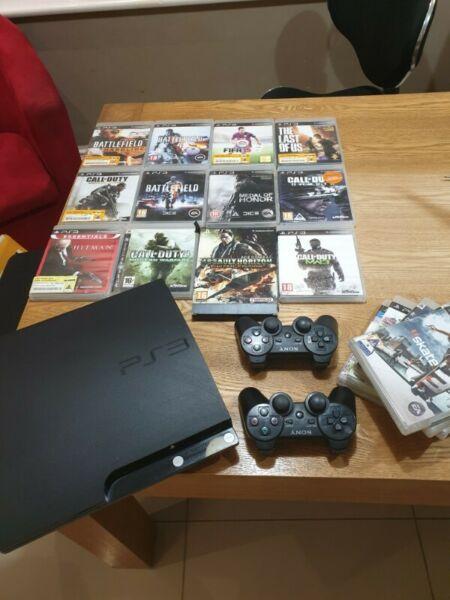 Sony PS3 with games and two controllers 