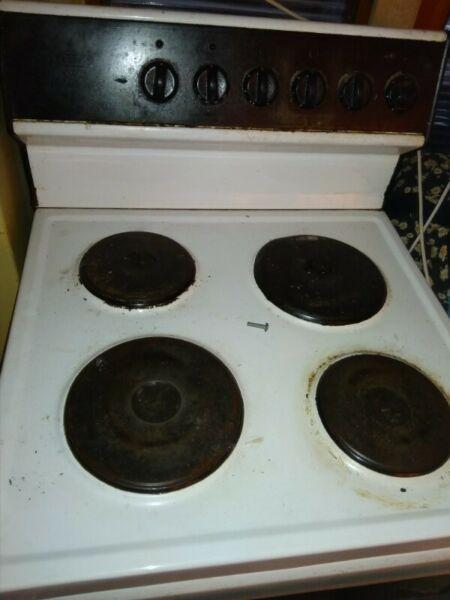 Stove, old and used but works for the most part 