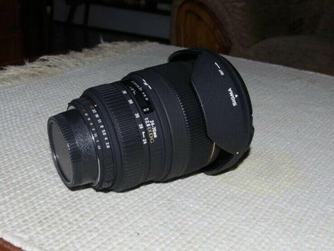 sigma for Nikon, 24-70 2.8 ex dg, nice clear sharp lens, front and rear caps and hood included. 