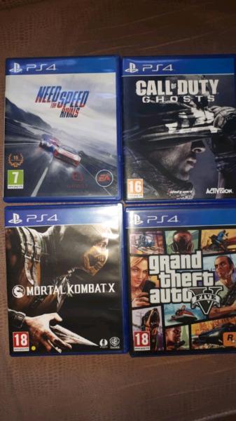 PS4 Slim 1TB for sale with two controllers and four games 