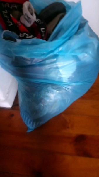 Bag of clothes and sneakers for sale 