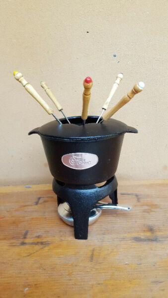 Beautiful cast iron fondue set. 