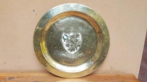 Lovely old brass emblem wall plate. 